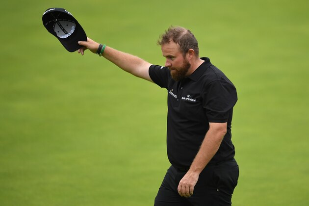 Ireland's Shane Lowry smiles as he finishes at the 18th green during the second round of the British Open golf Championships at Royal Portrush golf club in Northern Ireland on July 19, 2019. (Photo by Glyn KIRK / AFP) / RESTRICTED TO EDITORIAL USE        (Photo credit should read GLYN KIRK/AFP/Getty Images)