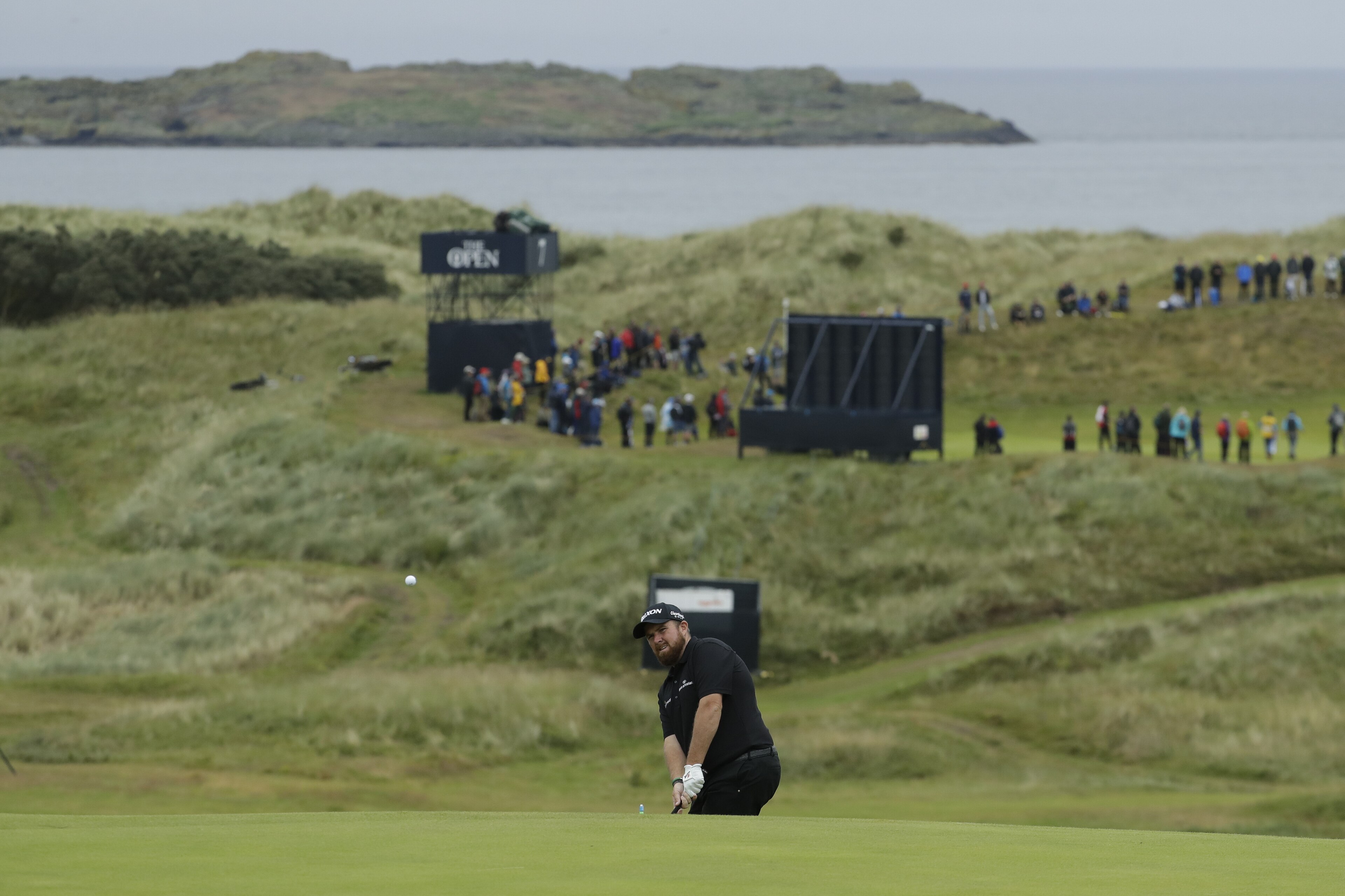 Ireland's Shane Lowry chips onto the 16th green during the second round of the British Open Golf Championships at Royal Portrush in Northern Ireland, Friday, July 19, 2019.(AP Photo/Matt Dunham)