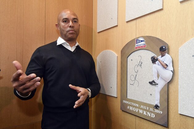 Baseball Hall of Fame inductee Mariano Rivera speaks after signing the backer board where his plaque will hang while visiting the National Baseball Hall of Fame and Museum, Friday, Feb. 1, 2019, in Cooperstown, N.Y. The former New York Yankees closer will be inducted on July 21. (AP Photo/Hans Pennink)