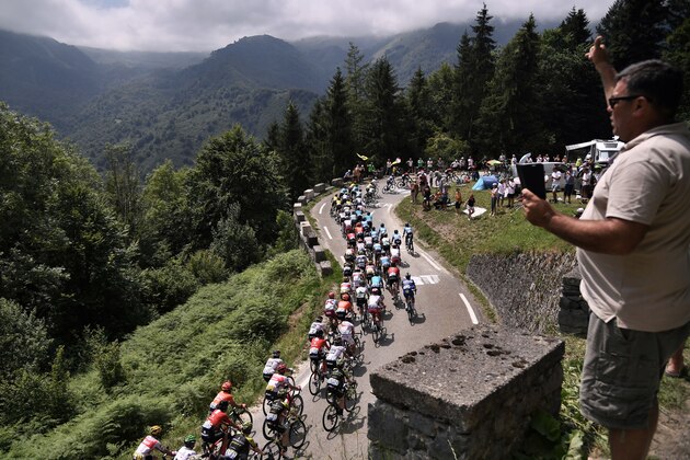 Cyclists ride up in a loop during the fourteenth stage of the 106th edition of the Tour de France cycling race between Tarbes and Tourmalet Bareges, on July 20, 2019. (Photo by Marco Bertorello / AFP)        (Photo credit should read MARCO BERTORELLO/AFP/Getty Images)