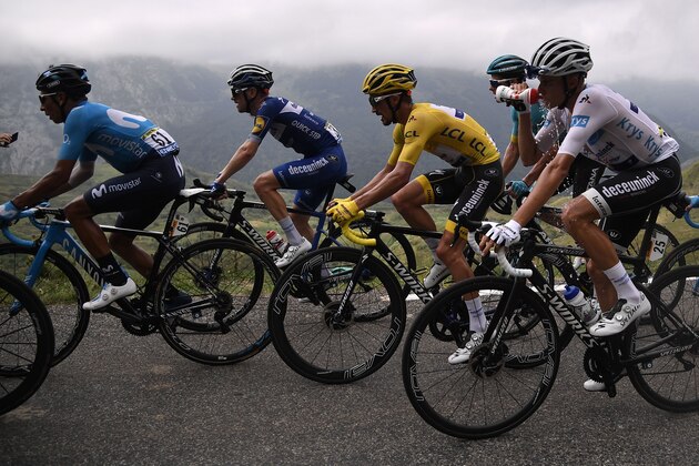 France's Julian Alaphilippe (2ndR), wearing the overall leader's yellow jersey, Colombia's Nairo Quintana (L), Spain's Enric Mas (R), wearing the best young's white jersey ride upduring the fourteenth stage of the 106th edition of the Tour de France cycling race between Tarbes and Tourmalet Bareges, on July 20, 2019. (Photo by Marco Bertorello / AFP)        (Photo credit should read MARCO BERTORELLO/AFP/Getty Images)