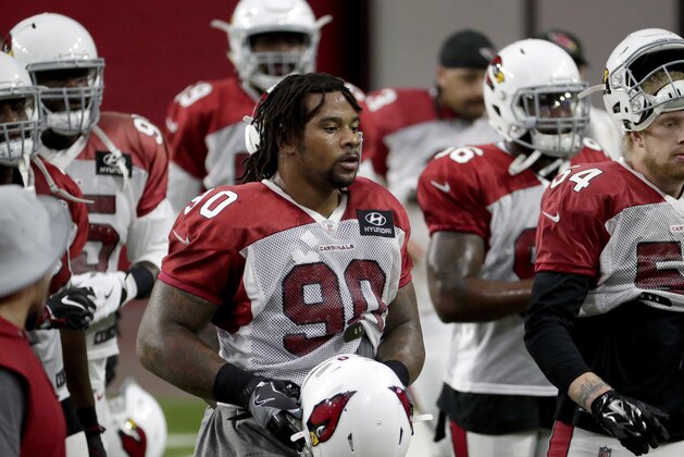 Arizona Cardinals defensive tackle Robert Nkemdiche (90) takes the field during an NFL football practice, Monday, July 30, 2018, in Glendale, Ariz. (AP Photo/Matt York)