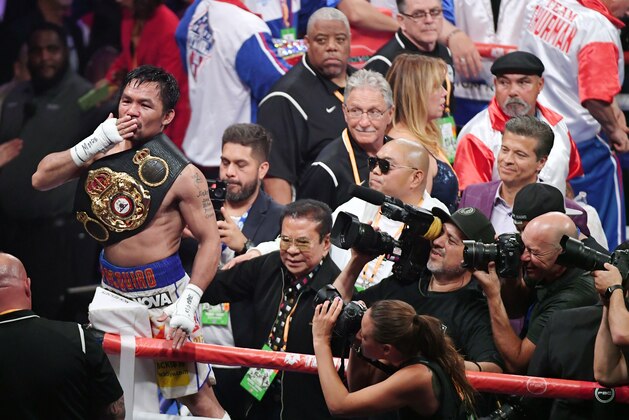 LAS VEGAS, NEVADA - JULY 20:  Manny Pacquiao blows a kiss to the crowd as he celebrates his split-decision victory over Keith Thurman in their WBA welterweight title fight at MGM Grand Garden Arena on July 20, 2019 in Las Vegas, Nevada.  (Photo by Ethan Miller/Getty Images)
