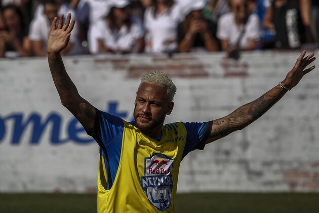 Brazilian football star Neymar celebrates after scoring during a five-a-side football tournament for his charity Neymar Junior Project Institute, in Praia Grande, Sao Paulo, Brazil, on July 13, 2019. (Photo by Miguel SCHINCARIOL / AFP)        (Photo credit should read MIGUEL SCHINCARIOL/AFP/Getty Images)