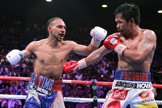 Filipino boxer Manny Pacquiao (R) and US boxer Keith Thurman during their WBA super world welterweight title fight at the MGM Grand Garden Arena on July 20, 2019 in Las Vegas, Nevada. - Pacquiao won a 12 round split decision. (Photo by John Gurzinski / AFP)        (Photo credit should read JOHN GURZINSKI/AFP/Getty Images)