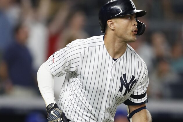 New York Yankees' Giancarlo Stanton watches his three-run home run as he runs the bases during the sixth inning of a baseball game against the Toronto Blue Jays, Monday, June 24, 2019, in New York. (AP Photo/Kathy Willens)