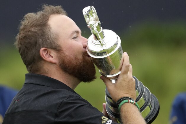 Ireland's Shane Lowry holds and kisses the Claret Jug trophy after winning the British Open Golf Championships at Royal Portrush in Northern Ireland, Sunday, July 21, 2019.(AP Photo/Peter Morrison)