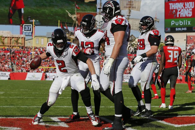 Atlanta Falcons quarterback Matt Ryan (2) celebrates after catching a 5-yard touchdown pass from Mohamed Sanu during the second half of an NFL football game against the Tampa Bay Buccaneers Sunday, Dec. 30, 2018, in Tampa, Fla. (AP Photo/Mark LoMoglio)