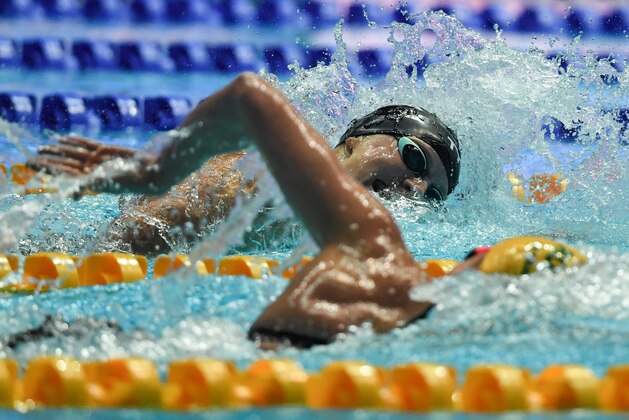 US Katie Ledecky (L) competes alongside Australia's Ariarne Titmus to take silver in the final of the women's 400m freestyle event during the swimming competition at the 2019 World Championships at Nambu University Municipal Aquatics Center in Gwangju, South Korea, on July 21, 2019. (Photo by Manan VATSYAYANA / AFP)        (Photo credit should read MANAN VATSYAYANA/AFP/Getty Images)