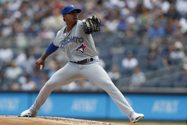 Toronto Blue Jays starting pitcher Marcus Stroman winds up during the first inning of a baseball game against the New York Yankees, Sunday, July 14, 2019, in New York. (AP Photo/Kathy Willens)
