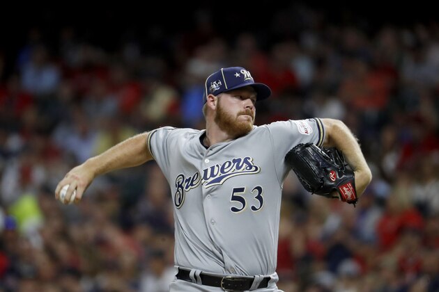 National League pitcher Brandon Woodruff, of the Milwaukee Brewers, throws during the seventh inning of the MLB baseball All-Star Game against the American League, Tuesday, July 9, 2019, in Cleveland. (AP Photo/John Minchillo)