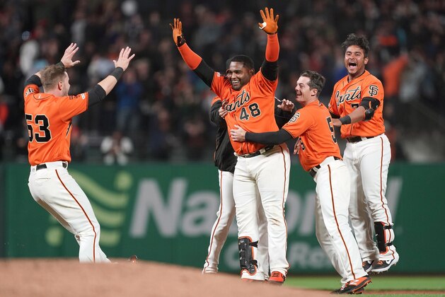 SAN FRANCISCO, CA - JULY 19:  Pablo Sandoval #48 of the San Francisco Giants and teammates celebrates after Sandoval hit a fly ball to left field that was dropped for an error by Dominic Smith #22 of the New York Mets allowing the Giants to win the game 1-0 in 10 inning at Oracle Park on July 19, 2019 in San Francisco, California.  (Photo by Thearon W. Henderson/Getty Images)