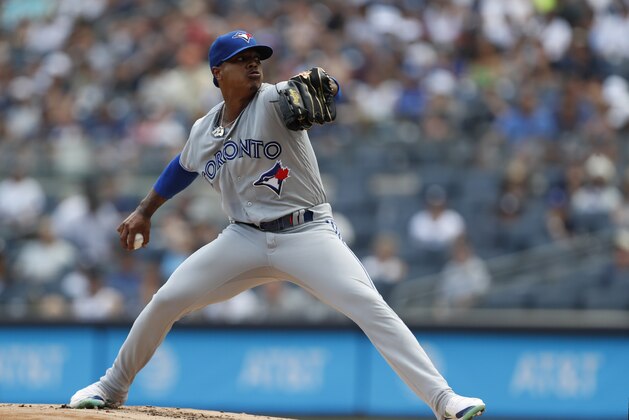 Toronto Blue Jays starting pitcher Marcus Stroman winds up during the first inning of a baseball game against the New York Yankees, Sunday, July 14, 2019, in New York. (AP Photo/Kathy Willens)