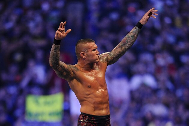 FILE- In this Sunday, April 3, 2011 file photo, WWE Superstar Randy Orton celebrates defeating CM Punk (not pictured) during WrestleMania XXVII at the Georgia Dome in Atlanta, Georgia on. World-famous WWE wrestlers such as John Cena, Shaemus and champion Randy Orton are in Saudi Arabia for three days of matches in the capital Riyadh. (Paul Abell/AP Images for WWE, File)