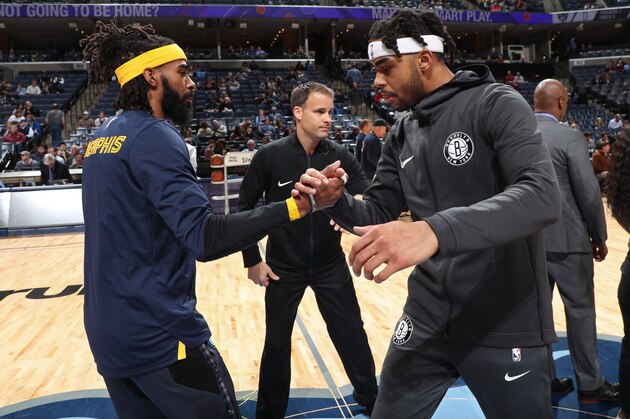 MEMPHIS, TN - JANUARY 4: Mike Conley #11 of the Memphis Grizzlies and D'Angelo Russell #1 of the Brooklyn Nets shake hands before the game on January 4, 2019 at FedExForum in Memphis, Tennessee. NOTE TO USER: User expressly acknowledges and agrees that, by downloading and/or using this photograph, user is consenting to the terms and conditions of the Getty Images License Agreement. Mandatory Copyright Notice: Copyright 2019 NBAE (Photo by Joe Murphy/NBAE via Getty Images)