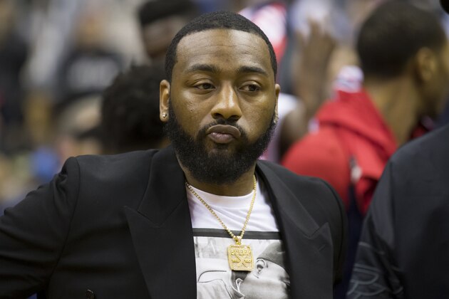 Washington Wizards guard John Wall stands on the court after an NBA basketball game against the San Antonio Spurs, Friday, April 5, 2019, in Washington. The Spurs won 129-112. (AP Photo/Alex Brandon)