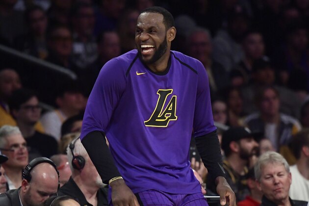 Los Angeles Lakers forward LeBron James laughs as he waits to check in to the team's NBA basketball game against the Charlotte Hornets during the second half Friday, March 29, 2019, in Los Angeles. The Lakers won 129-115. (AP Photo/Mark J. Terrill)