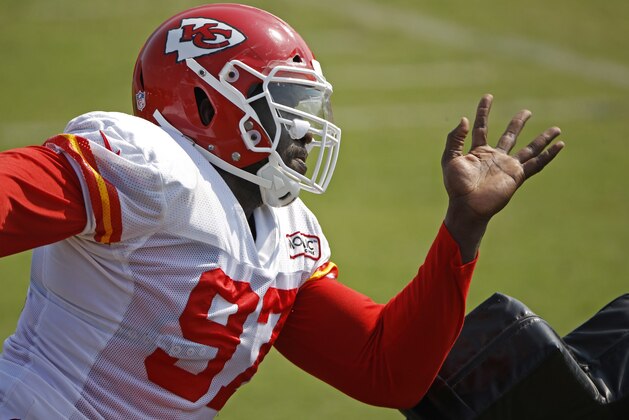 Kansas City Chiefs defensive end Allen Bailey works on a drill at NFL football training camp Sunday, Aug. 5, 2018, in St. Joseph, Mo. (AP Photo/Charlie Riedel)