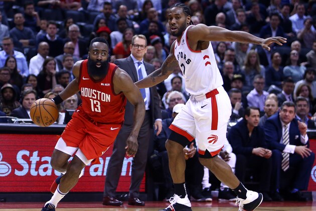 TORONTO, ON - MARCH 5:  James Harden #13 of the Houston Rockets dribbles the ball as Kawhi Leonard #2 of the Toronto Raptors defends during the second half of an NBA game at Scotiabank Arena on March 5, 2019 in Toronto, Canada.  NOTE TO USER: User expressly acknowledges and agrees that, by downloading and or using this photograph, User is consenting to the terms and conditions of the Getty Images License Agreement.  (Photo by Vaughn Ridley/Getty Images)