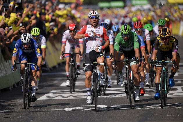 Australia's Caleb Ewan (2ndL) celebrates, past Slovakia's Peter Sagan (2ndR), wearing the best sprinter's green jersey as he wins on the finish line of the sixteenth stage of the 106th edition of the Tour de France cycling race between Nimes and Nimes, in Nimes, on July 23, 2019. (Photo by Marco Bertorello / AFP) (Photo credit should read MARCO BERTORELLO/AFP/Getty Images) Australia's Caleb Ewan (2ndL) celebrates, past Slovakia's Peter Sagan (2ndR), wearing the best sprinter's green jersey as he wins on the finish line of the sixteenth stage of the 106th edition of the Tour de France cycling race between Nimes and Nimes, in Nimes, on July 23, 2019. (Photo by Marco Bertorello / AFP) (Photo credit should read MARCO BERTORELLO/AFP/Getty Images)