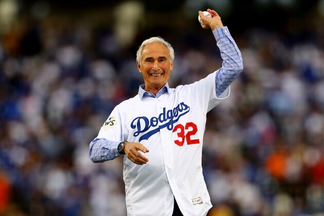 LOS ANGELES, CA - NOVEMBER 01:  Former Los Angeles Dodgers player Sandy Koufax throws out the ceremonial first pitch before game seven of the 2017 World Series between the Houston Astros and the Los Angeles Dodgers at Dodger Stadium on November 1, 2017 in Los Angeles, California.  (Photo by Tim Bradbury/Getty Images)
