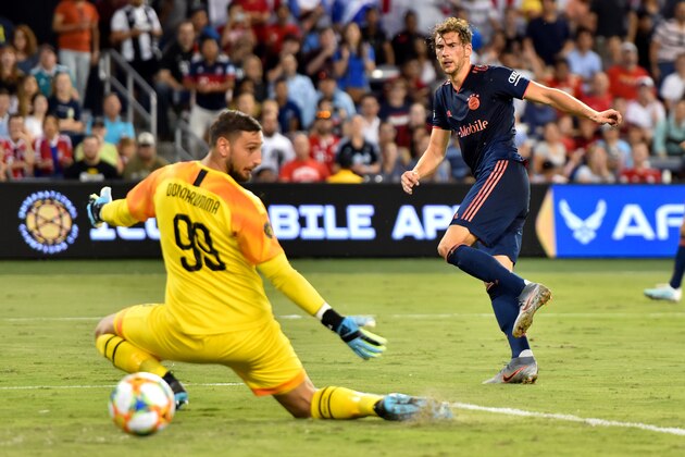 KANSAS CITY, MISSOURI - JULY 23: Leon Goretzka #18 of Bayern Munich puts a ball past Gianluigi Donnarumma #99 of Milan for the first goal of the match during the first half of the match at Children's Mercy Park on July 23, 2019 in Kansas City, Missouri. (Photo by Edward Zurga/International Champions Cup via Getty Images)