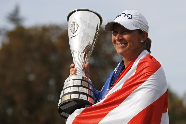 Angela Stanford of the U.S. poses with her trophy after winning the Evian Championship women's golf tournament in Evian, eastern France, Sunday, Sept. 16, 2018. (AP Photo/Francois Mori)