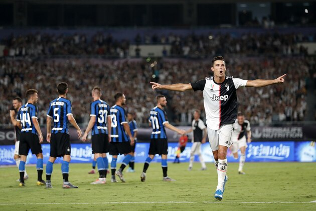 NANJING, CHINA - JULY 24: Cristiano Ronaldo of Juventus celebrates scoring his side's first goal from a free kick during the International Champions Cup match between Juventus and FC Internazionale at the Nanjing Olympic Center Stadium on July 24, 2019 in Nanjing, China. (Photo by Fred Lee/Getty Images)