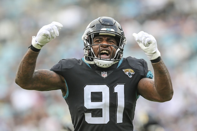 Jacksonville Jaguars defensive end Yannick Ngakoue (91) encourages the fans during the second half of an NFL football game against the Indianapolis Colts, Sunday, Dec. 2, 2018, in Jacksonville, Fla. (AP Photo/Gary McCullough)