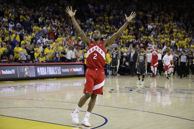 Toronto Raptors forward Kawhi Leonard celebrates after the Raptors defeat the Golden State Warriors 114-110 in Game 6 of basketball's NBA Finals in Oakland, Calif., Thursday, June 13, 2019. (AP Photo/Ben Margot)
