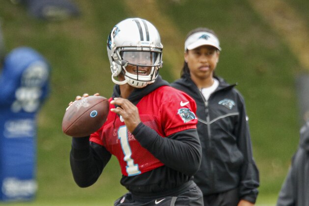 Carolina Panthers quarterback Cam Newton looks to pass during an NFL football practice in Charlotte, N.C., Wednesday, June 12, 2019. (AP Photo/Nell Redmond)