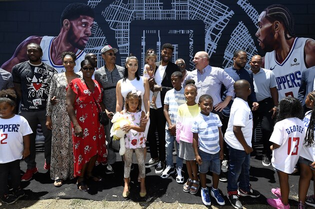 LOS ANGELES, CALIFORNIA - JULY 24: Kawhi Leonardand Paul George of the Los Angeles Clippers attend a mural unveiling after being introduced at Green Meadows Recreation Center on July 24, 2019 in Los Angeles, California. NOTE TO USER: User expressly acknowledges and agrees that, by downloading and or using this photograph, User is consenting to the terms and conditions of the Getty Images License Agreement. (Photo by Kevork Djansezian/Getty Images)