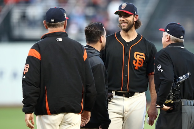 SAN FRANCISCO, CALIFORNIA - JULY 06:  Madison Bumgarner #40 of the San Francisco Giants is looked at by head athletic trainer Dave Groeschnerat and manager Bruce Bochy in the third inning of their game against the St. Louis Cardinals Oracle Park on July 06, 2019 in San Francisco, California. Bumgarner was hit by a line drive in the first inning and was taken out of the game in the third inning.  (Photo by Ezra Shaw/Getty Images)