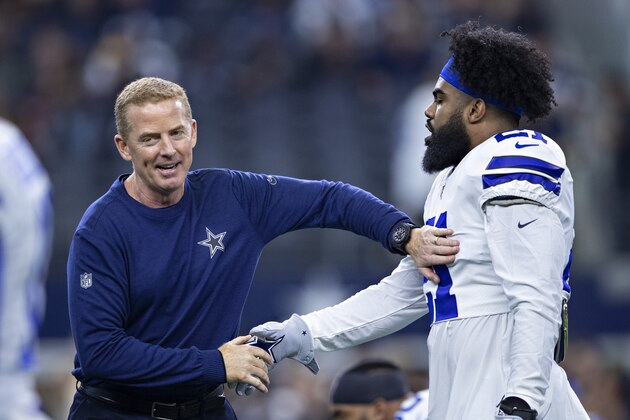 ARLINGTON, TX - NOVEMBER 22:  Head Coach Jason Garrett greets Ezekiel Elliott #21 of the Dallas Cowboys before a game against the Washington Redskins at AT&T Stadium on November 22, 2018 in Arlington, Texas.  The Cowboys defeated the Redskins 31-23.  (Photo by Wesley Hitt/Getty Images)