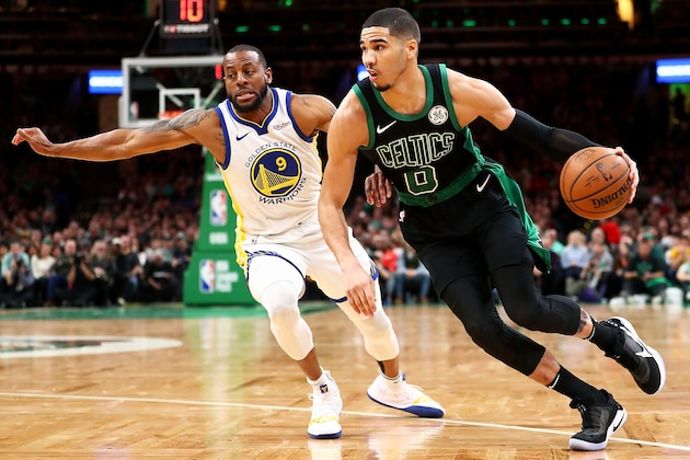BOSTON, MA - JANUARY 26:  Jayson Tatum #0 of the Boston Celtics dribbles past Andre Iguodala #9 of the Golden State Warriors during a game at TD Garden on January 26, 2019 in Boston, Massachusetts. NOTE TO USER: User expressly acknowledges and agrees that, by downloading and or using this photograph, User is consenting to the terms and conditions of the Getty Images License Agreement. (Photo by Adam Glanzman/Getty Images)