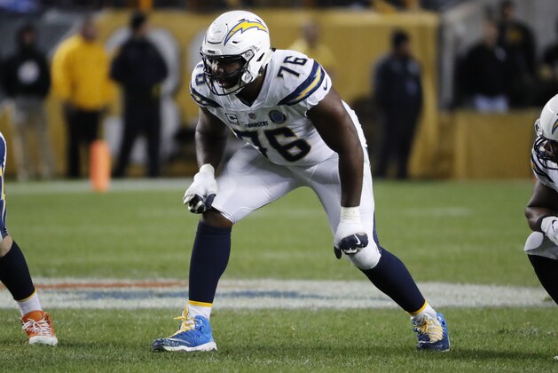 Los Angeles Chargers offensive tackle Russell Okung (76) plays during the second half of an NFL football game against the Pittsburgh Steelers in Pittsburgh, Sunday, Dec. 2, 2018. The Chargers won 33-30. (AP Photo/Gene J. Puskar)