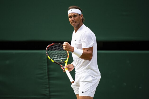 LONDON, ENGLAND - JULY 12: Rafael Nadal of Spain celebrates during his match against Roger Federer of Switzerland during Day 11 of The Championships - Wimbledon 2019 at All England Lawn Tennis and Croquet Club on July 12, 2019 in London, England. (Photo by TPN/Getty Images)