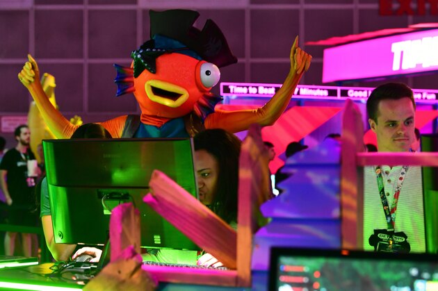 People play the game 'Fortnite' at the 2019 Electronic Entertainment Expo, also known as E3, opening in Los Angeles, California on June 11, 2019. - Gaming fans and developers gather, connecting thousands of the brightest, best and most innovative in the interactive entertainment industry and a chance for many to preview new games. (Photo by Frederic J. BROWN / AFP)        (Photo credit should read FREDERIC J. BROWN/AFP/Getty Images)