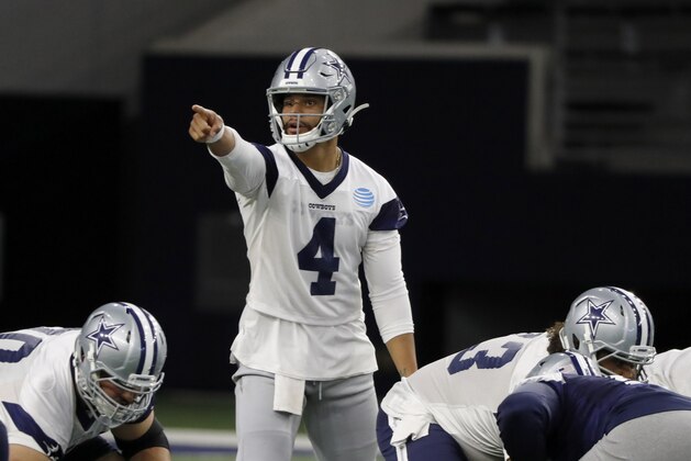 Dallas Cowboys quarterback Dak Prescott (4) gives instructions at the line of scrimmage as the team works out at their NFL football training facility in Frisco, Texas, Thursday, June 13, 2019. (AP Photo/Tony Gutierrez