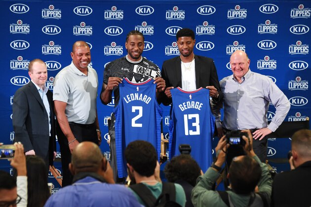LOS ANGELES, CA - JULY 24: Lawrence Frank, Doc Rivers, Kawhi Leonard #2, Paul George #13 and Steve Ballmer of the LA Clippers pose for a photo during a press conference at Green Meadows Recreation Center on July 24, 2019 in Los Angeles, California. NOTE TO USER: User expressly acknowledges and agrees that, by downloading and/or using this Photograph, user is consenting to the terms and conditions of the Getty Images License Agreement. Mandatory Copyright Notice: Copyright 2019 NBAE (Photo by Adam Pantozzi/NBAE via Getty Images)