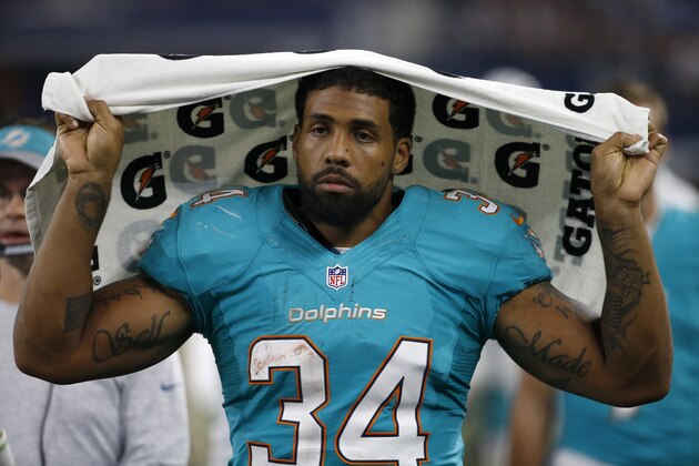 This Aug. 19, 2016 photo shows Miami Dolphins running back Arian Foster (34) walking along the sideline during an NFL preseason football game in Arlington, Texas. Four-time Pro Bowl running back Arian Foster has announced, Monday, Oct. 24, 2016, his retirement midway through an injury-plagued season with the Miami Dolphins. (AP Photo/Michael Ainsworth) This Aug. 19, 2016 photo shows Miami Dolphins running back Arian Foster (34) walking along the sideline during an NFL preseason football game in Arlington, Texas. Four-time Pro Bowl running back Arian Foster has announced, Monday, Oct. 24, 2016, his retirement midway through an injury-plagued season with the Miami Dolphins. (AP Photo/Michael Ainsworth)
