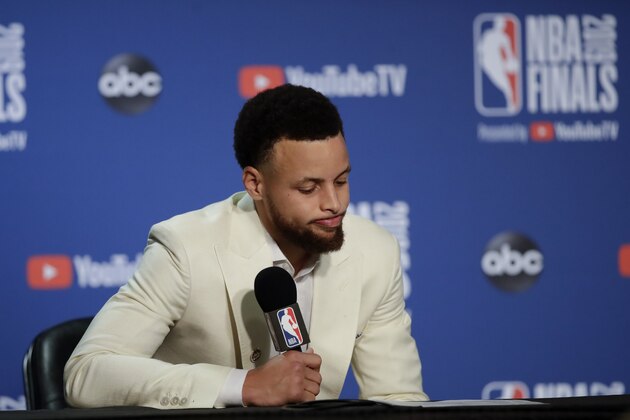 Golden State Warriors guard Stephen Curry speaks at a news conference after after the Toronto Raptors defeated the Warriors in game 6 of basketball's NBA Finals in Oakland, Calif., Thursday, June 13, 2019. (AP Photo/Ben Margot)