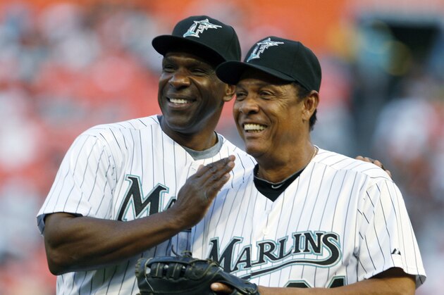 Baseball Hall of Fame players, outfielder Andre Dawson, left, and Tony Perez, pose after Dawson threw out the ceremonial first pitch before a baseball game between the Florida Marlins and the Los Angeles Dodgers, Friday, April 9, 2010, in Miami. (AP Photo/Wilfredo Lee)