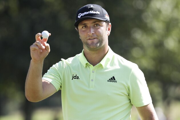 Jon Rahm, of Spain, acknowledges the applause as he leaves the ninth green during the first round of the World Golf Championships-FedEx St. Jude Invitational Thursday, July 25, 2019, in Memphis, Tenn. (AP Photo/Mark Humphrey)