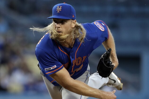 New York Mets starting pitcher Noah Syndergaard watches a throw to a Los Angeles Dodgers batter during the second inning of a baseball game Wednesday, May 29, 2019, in Los Angeles. (AP Photo/Marcio Jose Sanchez)