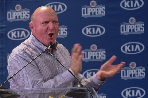 From left, Los Angeles Clippers team chairman Steve Ballmer introduces Paul George and Kawhi Leonard at a press conference at the Green Meadows Recreation Center in Los Angeles, Wednesday, July 23, 2019. (AP Photo/Ringo H.W. Chiu)