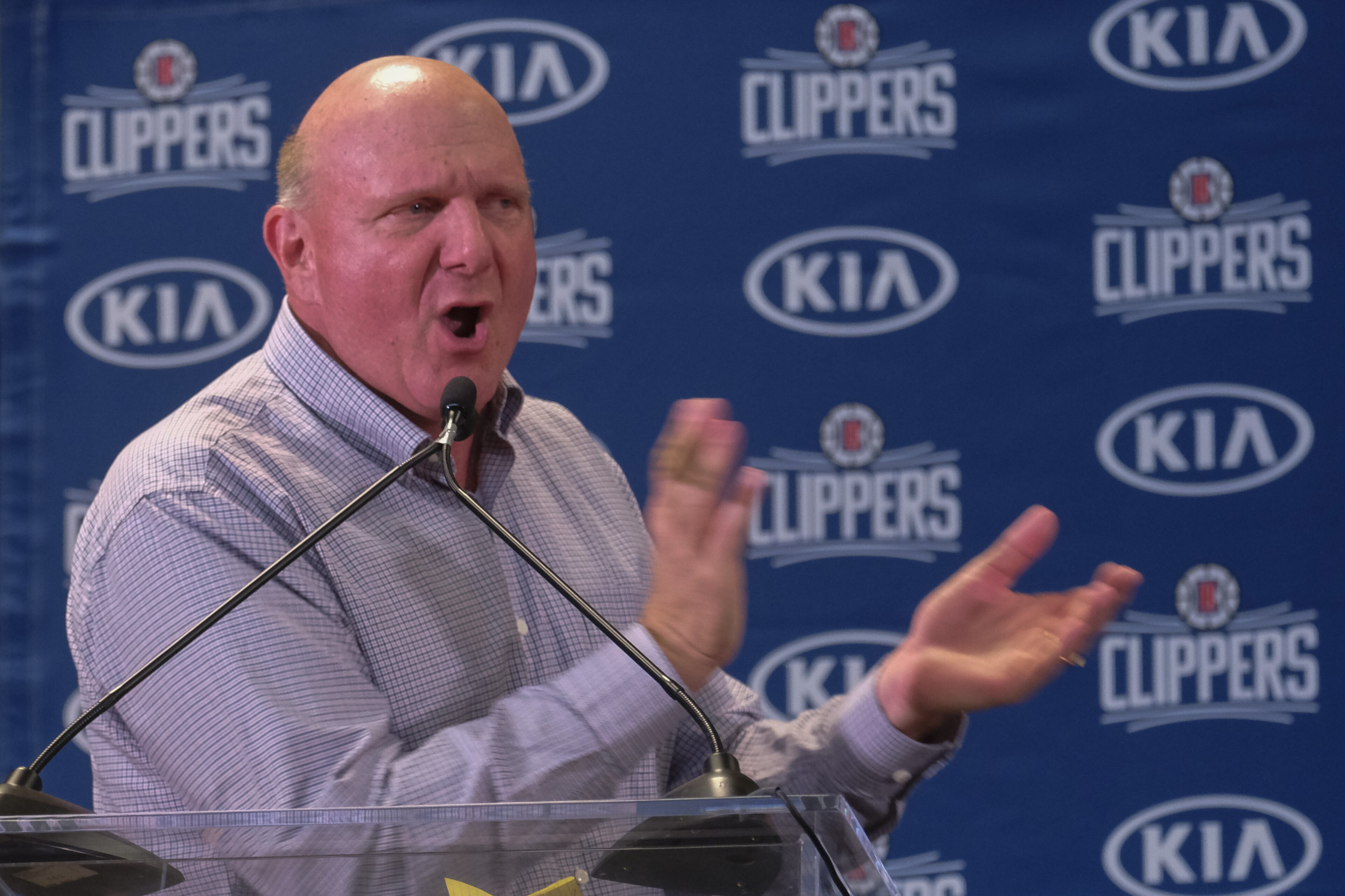 From left, Los Angeles Clippers team chairman Steve Ballmer introduces Paul George and Kawhi Leonard at a press conference at the Green Meadows Recreation Center in Los Angeles, Wednesday, July 23, 2019. (AP Photo/Ringo H.W. Chiu)