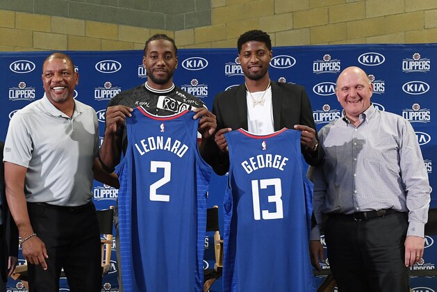 LOS ANGELES, CA - JULY 24: (L-R) Head coach Doc Rivers, Paul George, Kawhi Leonard and owner Steve Ballmer of the Los Angeles Clippers attend the Paul George and Kawhi Leonard introductory press conference at Green Meadows Recreation Center on July 24, 2019 in Los Angeles, California. NOTE TO USER: User expressly acknowledges and agrees that, by downloading and or using this photograph, User is consenting to the terms and conditions of the Getty Images License Agreement. (Photo by Kevork Djansezian/Getty Images)
