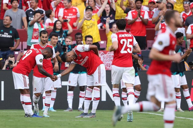 LANDOVER, MD - JULY 23: Pierre-Emerick Aubameyang of Arsenal celebrates after scoring a goal to make it 0-2 during the International Champions Cup fixture between Real Madrid and Arsenal at FedExField on July 23, 2019 in Landover, Maryland. (Photo by Matthew Ashton - AMA/Getty Images)