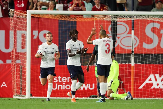 NEW YORK, NY - JULY 24: Divock Origi celebrates after scoring a goal to make it 1-1 during the Pre-Season Friendly match between Sporting CP and Liverpool at Yankee Stadium on July 24, 2019 in New York City. (Photo by Matthew Ashton - AMA/Getty Images)